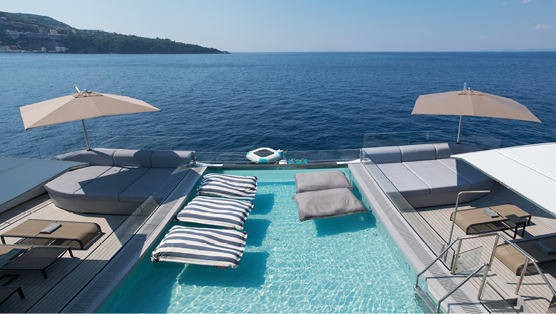 Man swimming in a pool on board a luxury yacht.