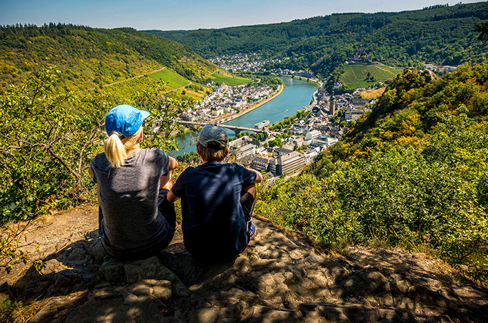Two guests seeing the sights of a European river