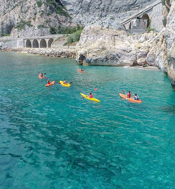 Emerald guests kayaking off the Amalfi Coastline