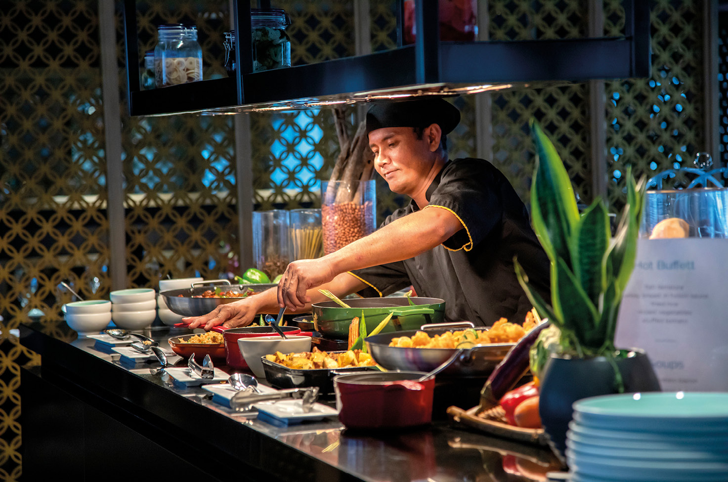 Expert chef preparing Southeast Asian cuisine